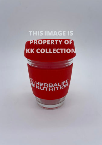 Red travel cup with silicone lid and band