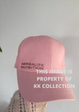 Pale pink cap with rose gold branding