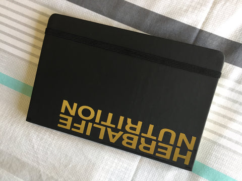 Black journal with gold branding